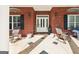 Inviting front porch with rocking chairs and tiled flooring, creating a cozy outdoor seating area at 270 Morrow Rd, Newborn, GA 30056