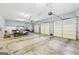 Bright and spacious four car garage with three doors and side golf cart parking at 270 Morrow Rd, Newborn, GA 30056