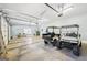 Large garage with multiple garage door openers, golf carts and storage area at 270 Morrow Rd, Newborn, GA 30056