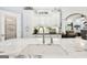 Bright kitchen with a white marbled island and sink, complemented by white cabinetry at 270 Morrow Rd, Newborn, GA 30056