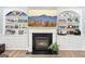 Living room featuring a fireplace with white built-in shelving and a large television at 270 Morrow Rd, Newborn, GA 30056