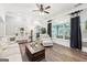 Bright living room featuring hardwood floors, a comfortable sofa, and an inviting open floor plan, perfect for gatherings at 270 Morrow Rd, Newborn, GA 30056