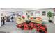 Open living room with multiple seating options and an eye-catching red and black circular rug at 270 Morrow Rd, Newborn, GA 30056