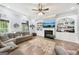 Spacious living room with hardwood floors, a fireplace and built-in shelving for storage at 270 Morrow Rd, Newborn, GA 30056