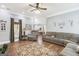 Open living room with hardwood floors, a ceiling fan and cozy furnishings at 270 Morrow Rd, Newborn, GA 30056