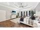 Spacious bedroom with tray ceiling, wood floors, and sitting area at 270 Morrow Rd, Newborn, GA 30056