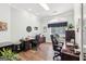 Bright office space with hardwood floors, ample desk space, and natural light at 270 Morrow Rd, Newborn, GA 30056