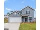 Inviting two-story home with a covered front porch and attached two-car garage at 7226 Lacey Drive # 125, Douglasville, GA 30134