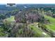Expansive aerial view showcasing golf course and proximity to the Chattahoochee River at 9995 Huntcliff Trce, Atlanta, GA 30350