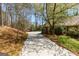 Long driveway and landscaping detail at 9995 Huntcliff Trce, Atlanta, GA 30350