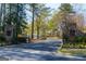 A view of the gated entrance to Cherokee Country Club at 9995 Huntcliff Trce, Atlanta, GA 30350