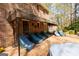 A brick patio off the rear of the home features multiple seating arrangements and room to entertain at 9995 Huntcliff Trce, Atlanta, GA 30350