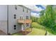 Backyard view of house with wood deck, vinyl siding, and fenced in lawn at 1483 Autumn Wind Dr # 24, Dacula, GA 30019