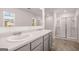 Bathroom features double sink vanity, large mirror and glass enclosed shower at 1483 Autumn Wind Dr # 24, Dacula, GA 30019