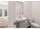 Modern powder room featuring pedestal sink and toilet at 1483 Autumn Wind Dr # 24, Dacula, GA 30019