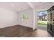 Inviting entryway showcasing hardwood floors, natural light, and a view of the neighborhood through the front door at 1483 Autumn Wind Dr # 24, Dacula, GA 30019