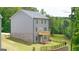 Exterior of home with back porch, vinyl siding and brick facade on lower level at 1483 Autumn Wind Dr # 24, Dacula, GA 30019