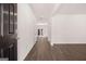 Spacious hallway with hardwood floors and access to multiple rooms, offering a glimpse into the home's layout at 1483 Autumn Wind Dr # 24, Dacula, GA 30019