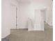 Upstairs hallway with neutral carpet and white trim at 1483 Autumn Wind Dr # 24, Dacula, GA 30019