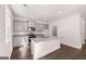 Well-lit kitchen showcasing granite countertops, stainless appliances, and an island with a sink at 1483 Autumn Wind Dr # 24, Dacula, GA 30019