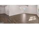 Open-concept living room with hardwood floors, recessed lighting, and a staircase, creating a bright and airy space at 1483 Autumn Wind Dr # 24, Dacula, GA 30019