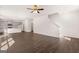 Open-concept living room with hardwood floors, and an adjacent kitchen, creating a seamless flow for entertaining at 1483 Autumn Wind Dr # 24, Dacula, GA 30019