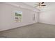 Bright and spacious main bedroom featuring neutral carpet and a ceiling fan at 1483 Autumn Wind Dr # 24, Dacula, GA 30019