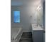 Bright bathroom with a large soaking tub and vanity with marble countertop at 2700 Marlin Dr, Mcdonough, GA 30253