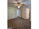 Large bedroom with ceiling fan, double closets, and access to bathroom at 2700 Marlin Dr, Mcdonough, GA 30253