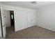 Bedroom with plush carpeting, double closets, and ample natural light at 2700 Marlin Dr, Mcdonough, GA 30253