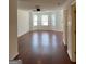 Bright living room with hardwood floors, fresh paint, and natural light from the bay window at 2700 Marlin Dr, Mcdonough, GA 30253