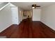 Open-concept living space featuring hardwood flooring, neutral walls, and access to multiple rooms at 2700 Marlin Dr, Mcdonough, GA 30253