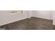 Bedroom with wood-look floors, window, and neutral wall color at 1473 Autumn Wind Dr # 25, Dacula, GA 30019