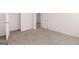 Bedroom with carpeted floor, white walls, and a closet at 1473 Autumn Wind Dr # 25, Dacula, GA 30019