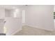 Hallway with neutral carpet, white walls, and white trim at 1473 Autumn Wind Dr # 25, Dacula, GA 30019