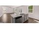 Open kitchen with granite countertops, stainless steel dishwasher, and view of living room at 1473 Autumn Wind Dr # 25, Dacula, GA 30019