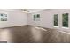 Bright living room with wood-look floors, natural light, and views of the backyard at 1473 Autumn Wind Dr # 25, Dacula, GA 30019