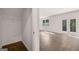 Bright, open-concept living space with wood floors and glass doors to the backyard at 1473 Autumn Wind Dr # 25, Dacula, GA 30019