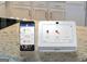 Smart home system shows thermostat, security, garage door and camera access on a mobile app at 1473 Autumn Wind Dr # 25, Dacula, GA 30019