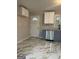 Stylish kitchen showcasing updated appliances, gray countertops, white and gray cabinetry, and decorative backsplash at 2953 Meadowview Se Dr, Atlanta, GA 30316