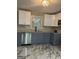 Bright kitchen features stainless steel appliances, granite countertops, and stylish white and gray cabinetry at 2953 Meadowview Se Dr, Atlanta, GA 30316