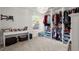 Bedroom with built-in closet organizer and white desk at 1511 Arica Ave, Lawrenceville, GA 30043