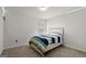 Cozy bedroom with carpet, window and striped bedding at 1511 Arica Ave, Lawrenceville, GA 30043