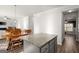 Kitchen island with granite countertops with views to dining and living areas at 1511 Arica Ave, Lawrenceville, GA 30043