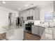 Modern kitchen with stainless steel appliances, an island, and ample counter space at 1511 Arica Ave, Lawrenceville, GA 30043