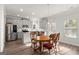 Kitchen and dining area featuring stainless steel appliances and hardwood floors at 1511 Arica Ave, Lawrenceville, GA 30043