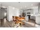 Kitchen and dining area featuring stainless steel appliances and hardwood floors at 1511 Arica Ave, Lawrenceville, GA 30043