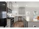 Modern kitchen with stainless steel appliances, granite countertops, and modern finishes at 1511 Arica Ave, Lawrenceville, GA 30043