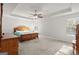 Spacious main bedroom with tray ceiling, large bed, and natural light at 1511 Arica Ave, Lawrenceville, GA 30043