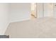 Bedroom featuring plush carpet with a bathroom visible through the doorway at 7222 Lacey Dr. # 127, Douglasville, GA 30134